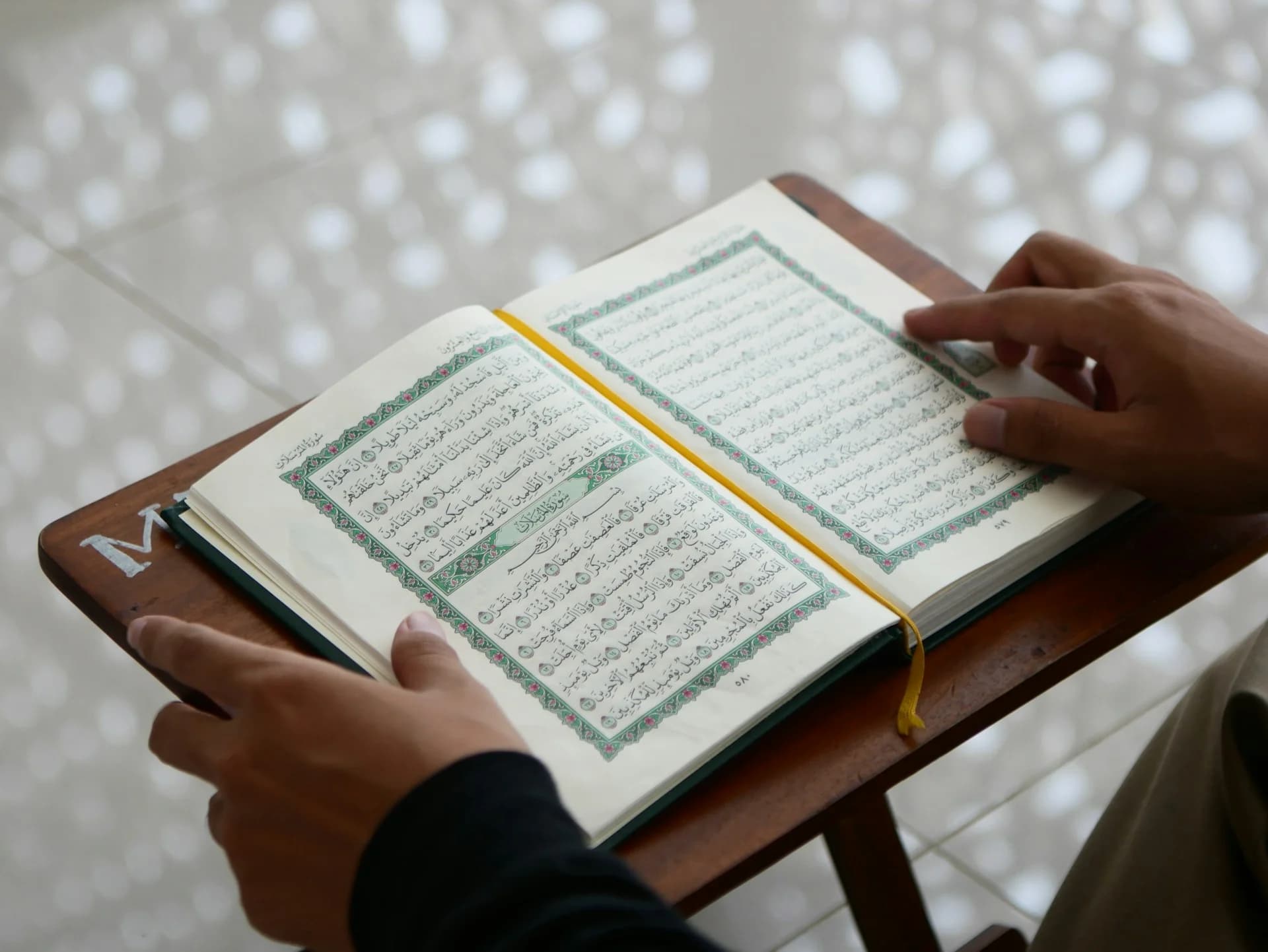 Muslim reciting the Quran daily with focus and devotion